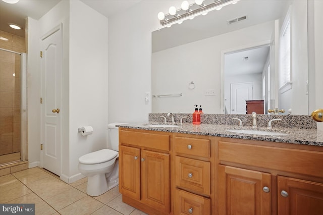 full bathroom featuring toilet, a sink, visible vents, and tile patterned floors