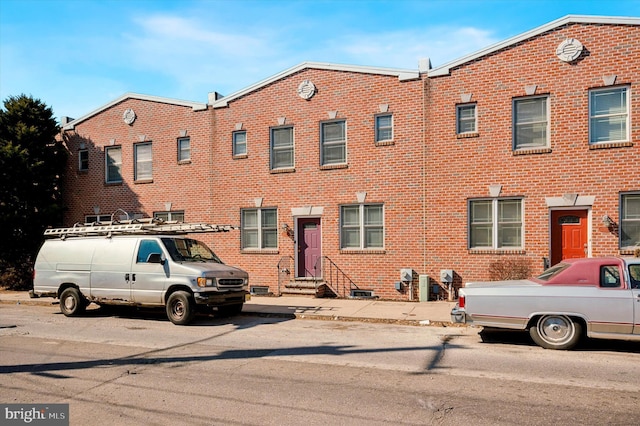 multi unit property with entry steps and brick siding