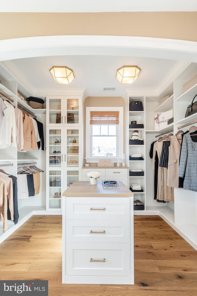 walk in closet with visible vents and light wood-style flooring