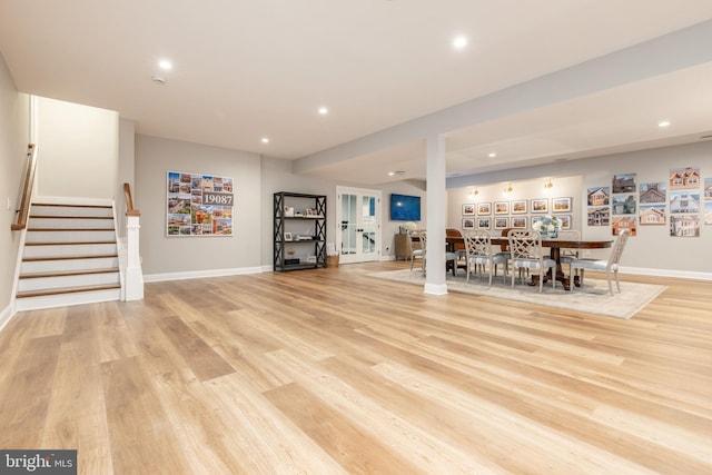 interior space with stairs, light wood-type flooring, baseboards, and recessed lighting