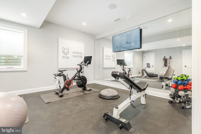 workout room with recessed lighting, visible vents, and baseboards