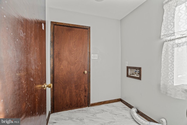 interior space featuring marble finish floor and baseboards