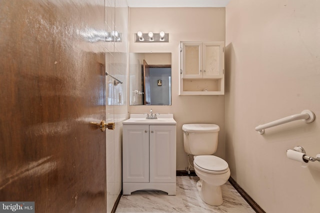 bathroom with marble finish floor, baseboards, vanity, and toilet