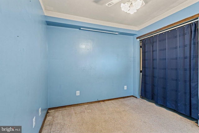 unfurnished bedroom with a closet, carpet flooring, and baseboards