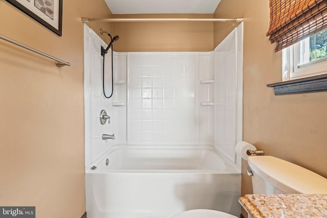 full bath featuring washtub / shower combination, vanity, and toilet