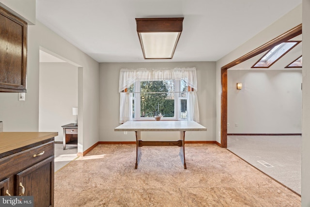 office with light colored carpet, visible vents, and baseboards