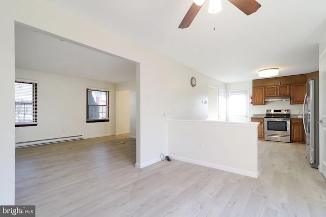 246 First Ave, State College, PA 16801 - kitchen featuring brown cabinets, stainless steel appliances, a baseboard radiator, open floor plan, and under cabinet range hood