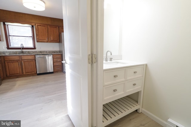 246 First Ave, State College, PA 16801 - interior space with baseboards, a baseboard heating unit, wood finished floors, and vanity