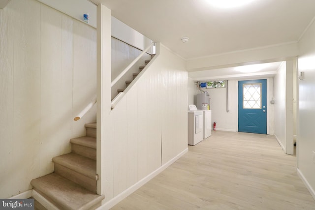 246 First Ave, State College, PA 16801 - below grade area featuring stairs, washer and dryer, water heater, and wood finished floors