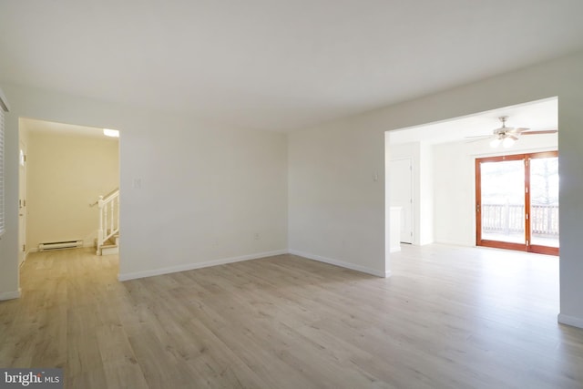 246 First Ave, State College, PA 16801 - empty room with baseboards, a ceiling fan, a baseboard radiator, light wood-style flooring, and stairway