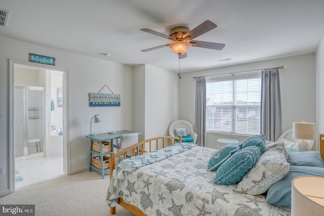 bedroom featuring a ceiling fan, carpet, visible vents, and ensuite bathroom