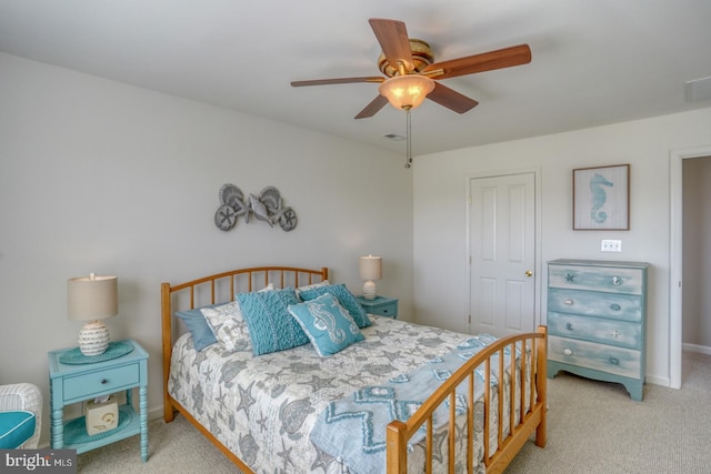 carpeted bedroom featuring ceiling fan and baseboards