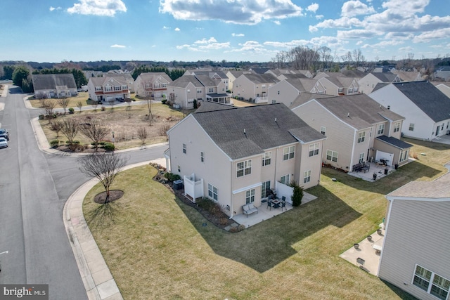 birds eye view of property with a residential view