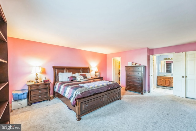 carpeted bedroom with connected bathroom