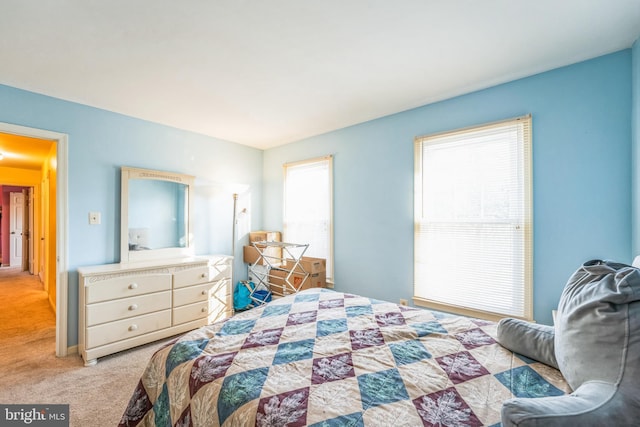 bedroom featuring light colored carpet