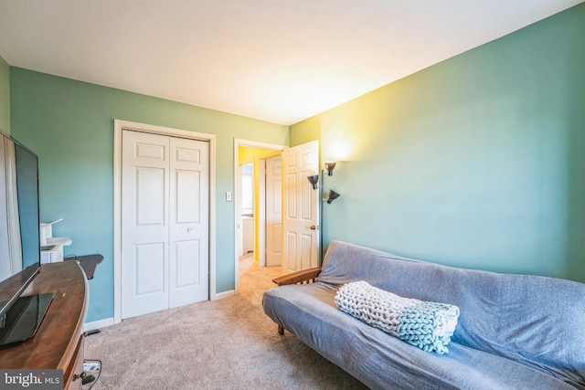 interior space featuring carpet flooring and baseboards