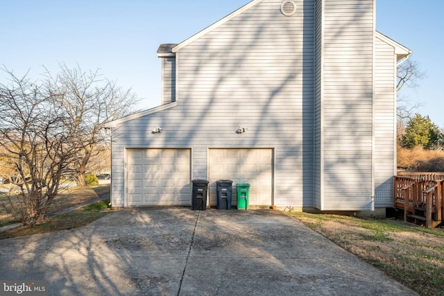 view of home's exterior featuring driveway