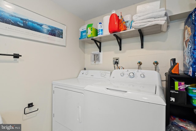 clothes washing area featuring laundry area and independent washer and dryer