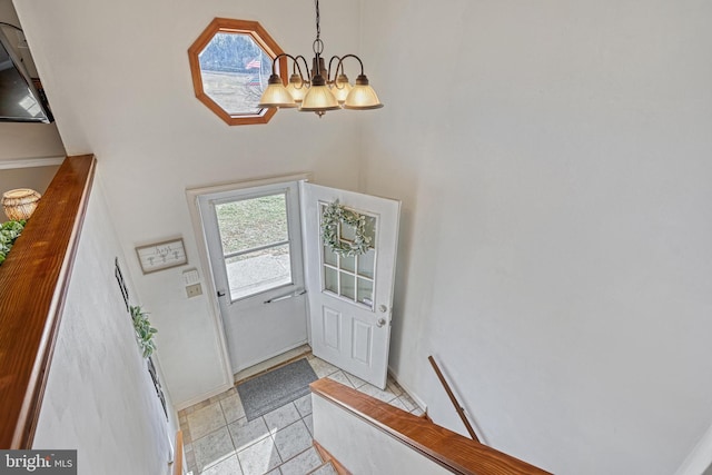 foyer entrance with an inviting chandelier