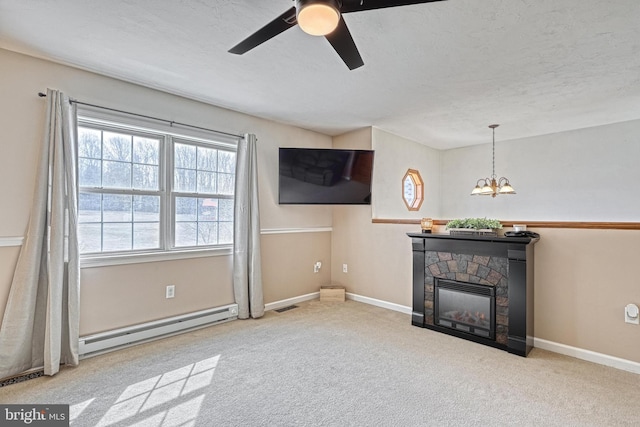 unfurnished living room featuring a textured ceiling, baseboard heating, carpet flooring, and a stone fireplace