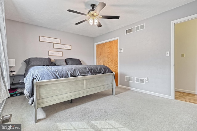 bedroom featuring carpet, visible vents, and baseboards