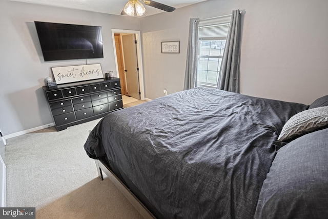 bedroom featuring carpet flooring, ceiling fan, and baseboards