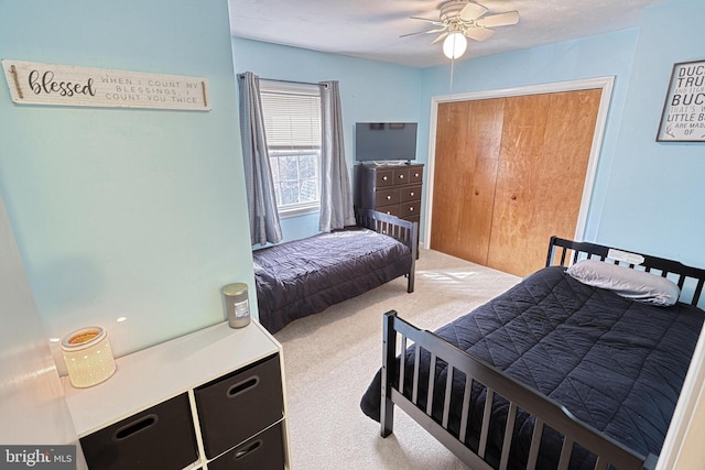 bedroom featuring light carpet and ceiling fan