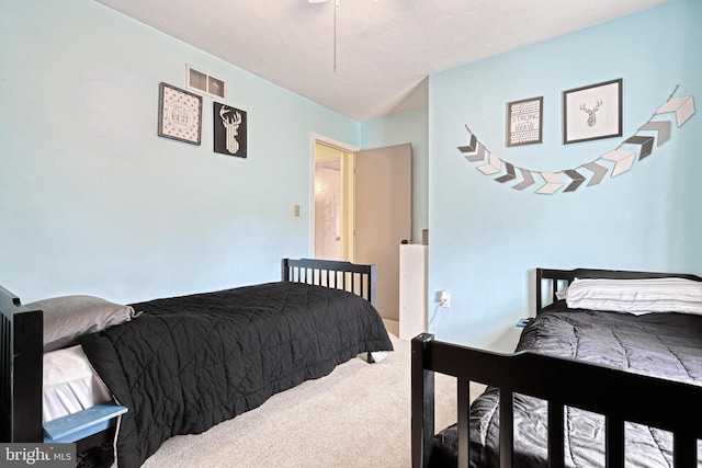 carpeted bedroom with visible vents