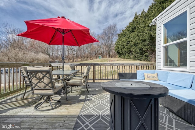 deck featuring an outdoor hangout area and outdoor dining space