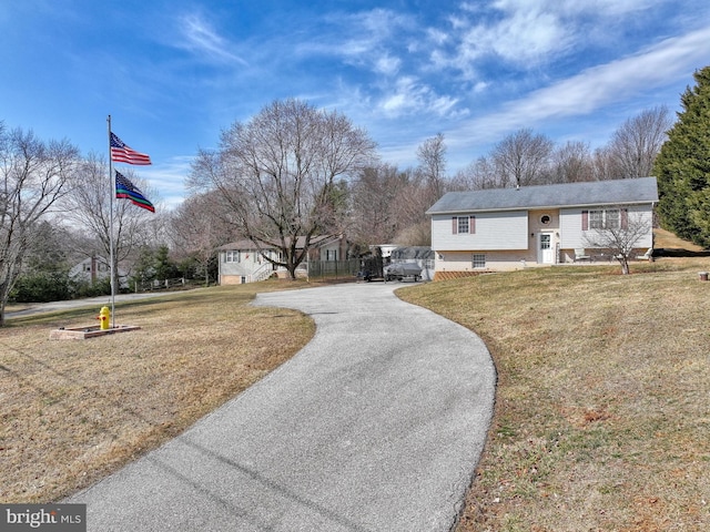 view of street featuring aphalt driveway