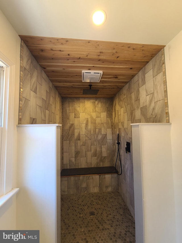 interior space featuring wood ceiling and a walk in shower