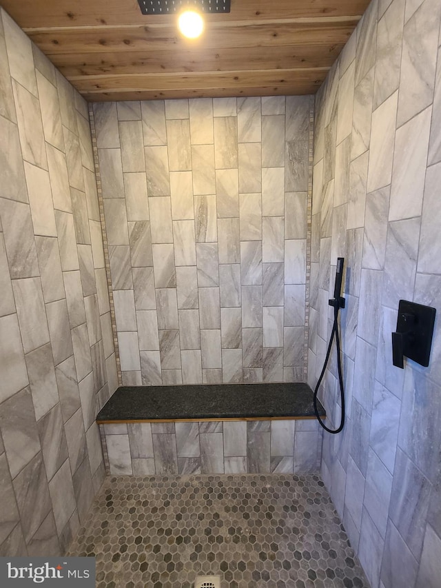 full bathroom featuring wooden ceiling and a tile shower