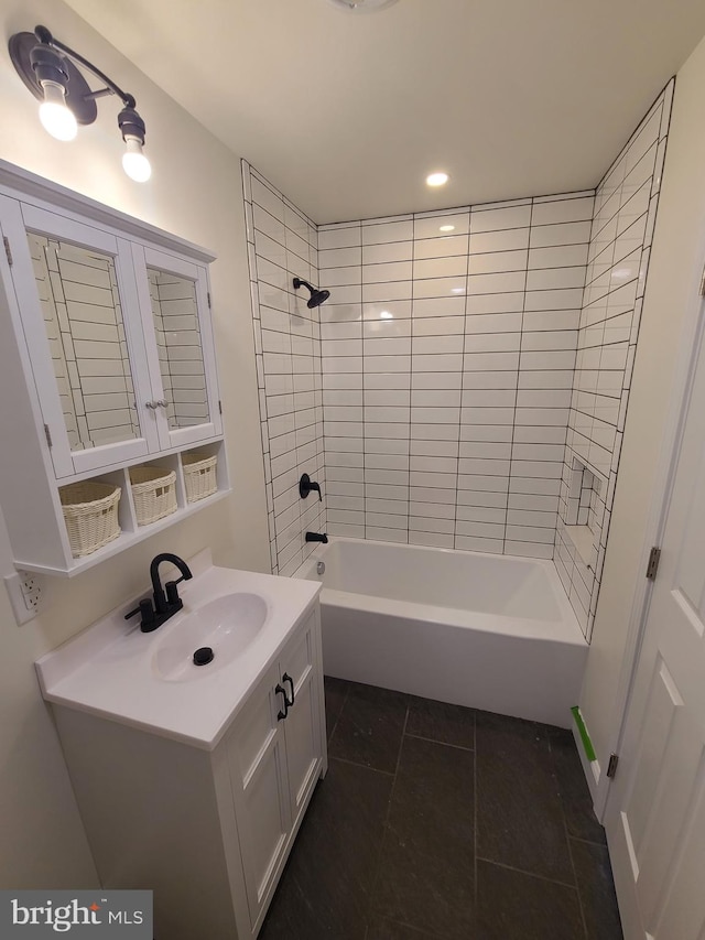 bathroom with tile patterned flooring, vanity, and bathtub / shower combination