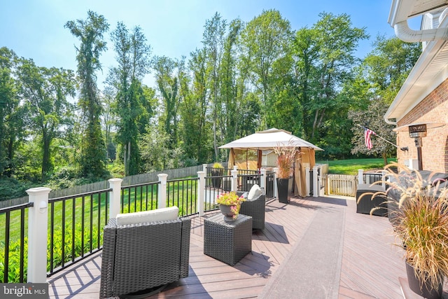 wooden deck with a yard and fence