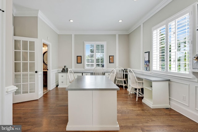 kitchen with a healthy amount of sunlight, ornamental molding, open shelves, and dark wood-style flooring