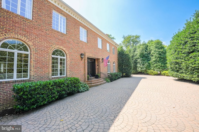 view of front of property featuring brick siding