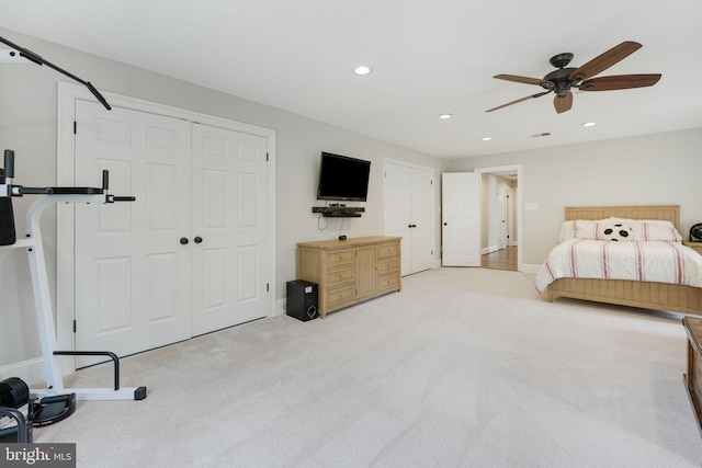 bedroom featuring a ceiling fan, recessed lighting, light colored carpet, and baseboards