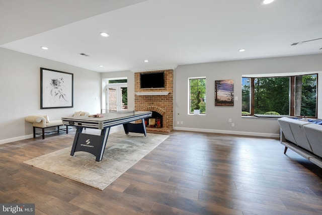 playroom featuring recessed lighting, a fireplace, baseboards, and wood finished floors