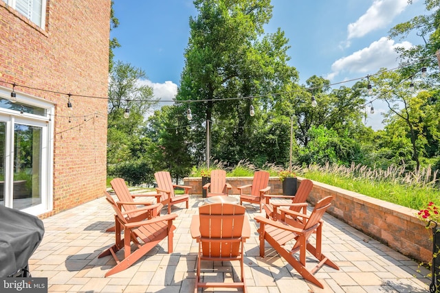 view of patio featuring a fire pit and grilling area