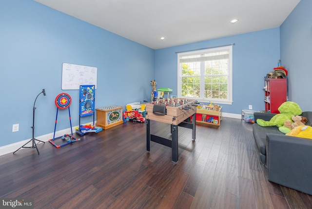 recreation room featuring recessed lighting, baseboards, and wood finished floors