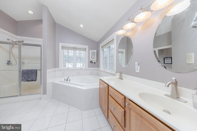 full bath featuring tile patterned floors, a stall shower, vaulted ceiling, a sink, and a bath