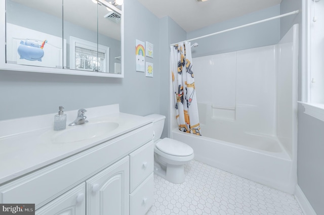 bathroom featuring toilet, visible vents, shower / tub combo with curtain, and vanity