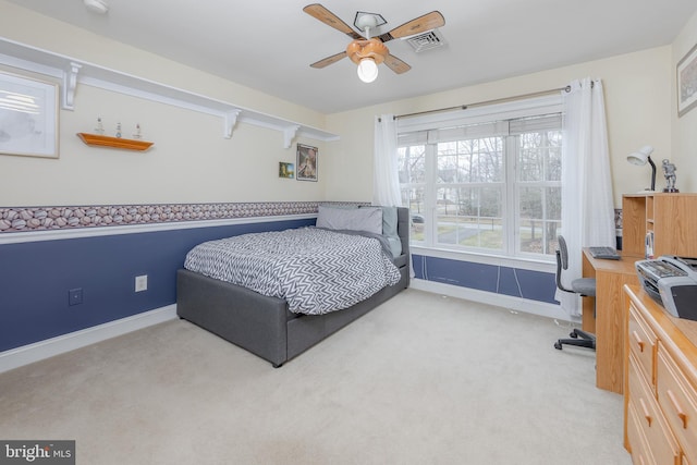 bedroom with light carpet, baseboards, visible vents, and a ceiling fan