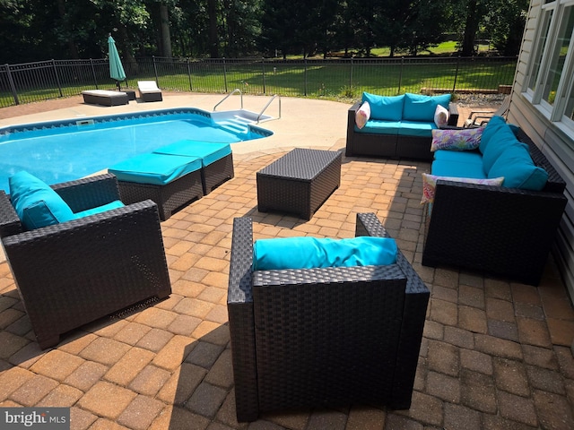 view of pool featuring a patio area, a fenced backyard, outdoor lounge area, and a fenced in pool