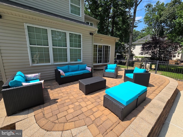 view of patio / terrace with fence and an outdoor hangout area