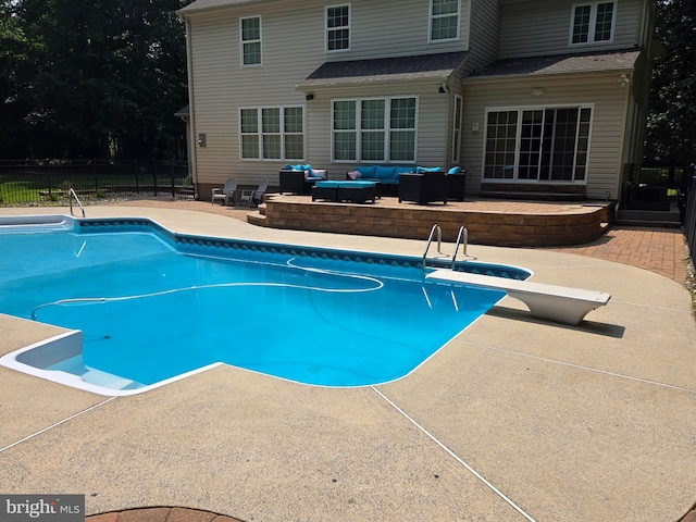 view of swimming pool featuring an outdoor hangout area, a patio area, fence, and a fenced in pool