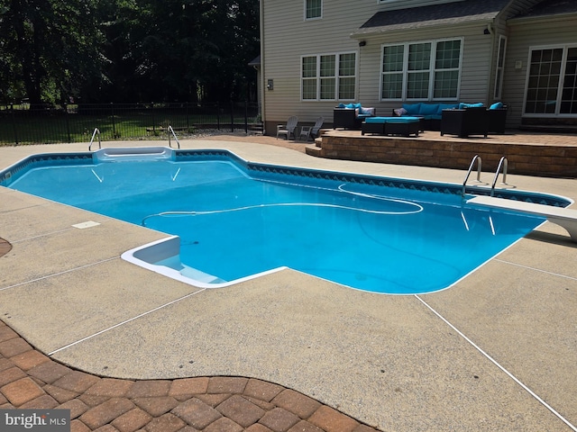 view of pool with a fenced in pool, a patio, an outdoor living space, and fence