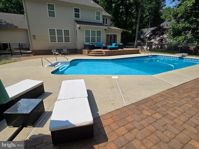 view of swimming pool featuring fence, a fenced in pool, and a patio