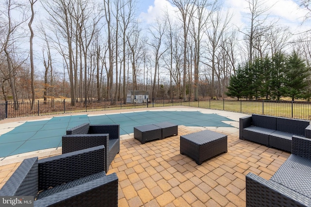 view of pool with a fenced in pool, a patio area, outdoor lounge area, and fence