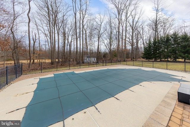 view of pool with a patio area, fence, and a fenced in pool